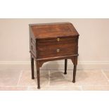 An early 18th century oak bureau, of cottage proportions, possibly Welsh, the hinged front opening