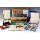 A collection of vintage optician's equipment, including; 25+ pairs of spectacles (including eight