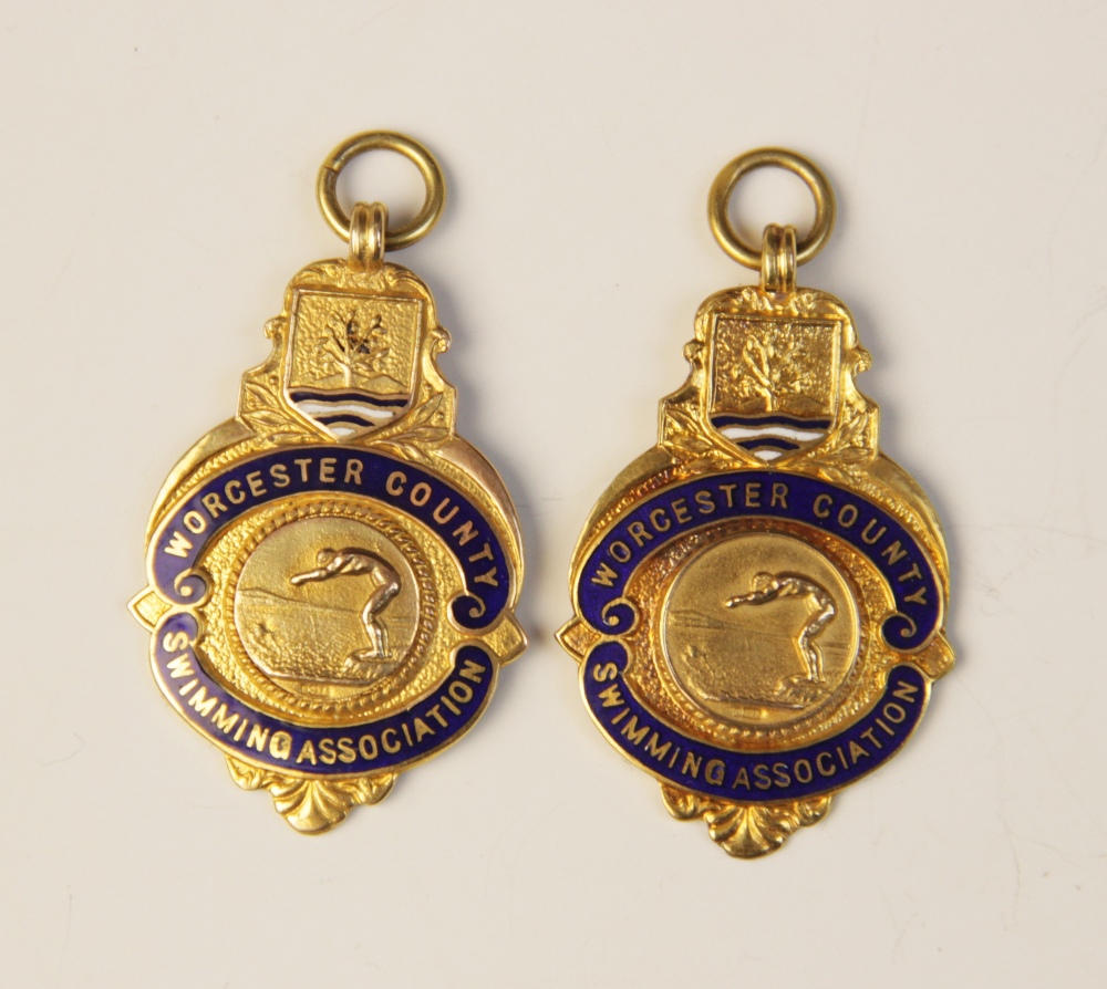 Two George V 9ct gold enamelled medallions for the Worcester County Swimming Association,