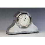 A French Edwardian silver plated mantle clock, circular dial with Arabic numerals, key-wind movement