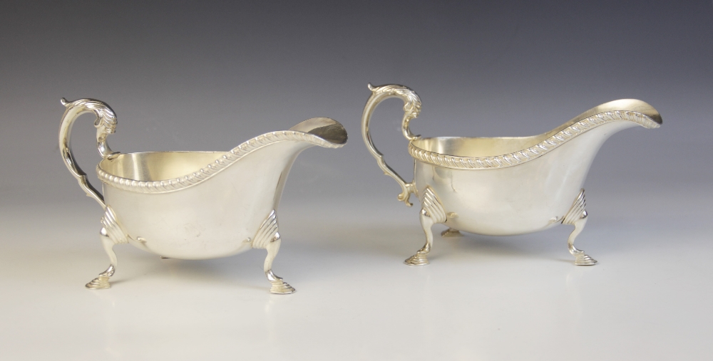 Two George V silver sauce boats, retailed by Lowes, Chester 1934, one marked for Stokes & Ireland