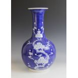 A Chinese porcelain blue and white bottle vase, Jingdezhen, decorated in the prunus patter, blue