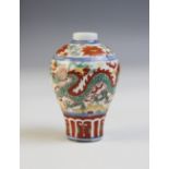 A Chinese porcelain vase, Qianlong mark, of miniature meiping form and decorated in a rouge de fer