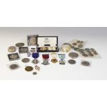 A selection of coins and medallions, to include a silver box inset with European coins, assorted