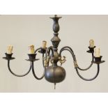 An early 20th century brass Dutch style five branch light fitting, the central bulbous column