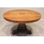 A William IV rosewood breakfast table, the circular tilt top raised on a triform pedestal applied