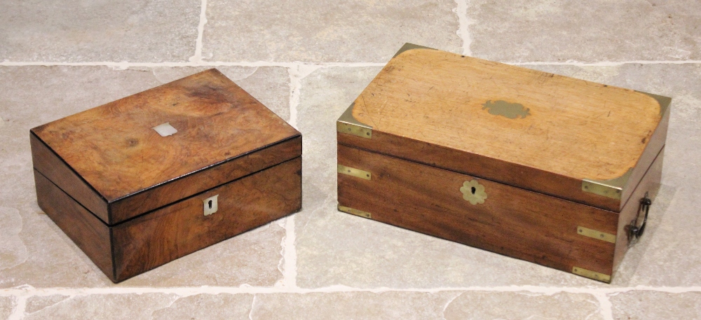 A mid 19th century mahogany campaign writing box, applied with brass corner brackets and a shaped