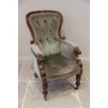 A Victorian mahogany framed drawing room chair, in green velour, the shaped and button back