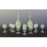A pair of Bohemian painted clear glass decanters, 19th century, each of baluster form with knopped