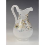 A Bohemian opaline glass ewer, late 19th century, designed with flowers and formal scrolls, of