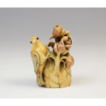 A Chinese carved ivory okimono of small proportions, 19th century, modelled as an exotic bird