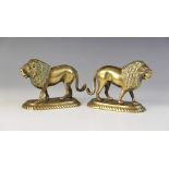A pair of Indian brass models of lions, late 19th/early 20th century, each modelled standing on an