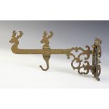A Victorian brass Spit Jack crane, the pierced hearth bracket supporting an arm with Stags head