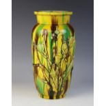 A Japanese Sancai glazed baluster vase, late 19th century, applied with magnolia sprays, 26cm high