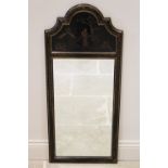 An early 20th century chinoiserie pier mirror, the arched pediment detailed in gilt with a female