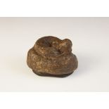 A Victorian novelty papier mache snuff box, designed as a dogs faeces, hinged cover, 7cm wide