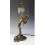 After Henri Coutheillas (French, 1862-1927), an Art Nouveau bronze figural table lamp, modelled as a