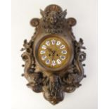 A 19th century bronze patinated wall clock, in the baroque style, the 'C' scroll case cast in relief
