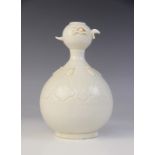 An unusual Chinese Dehua porcelain bottle vase in the Yue Kiln manner, the lower body incised with