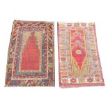 Two Ethnic design wool rugs, each in red, yellow and blue dyes with central open field designs,