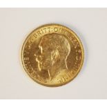 A George V gold sovereign, dated 1915, weight 7.9gms