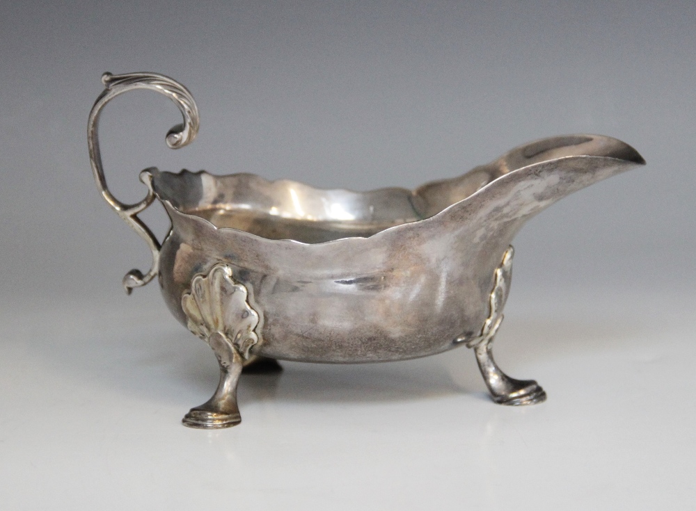A George II silver sauce boat, Isaac Cookson, Newcastle 1752, of typical form with scalloped border, - Image 2 of 3