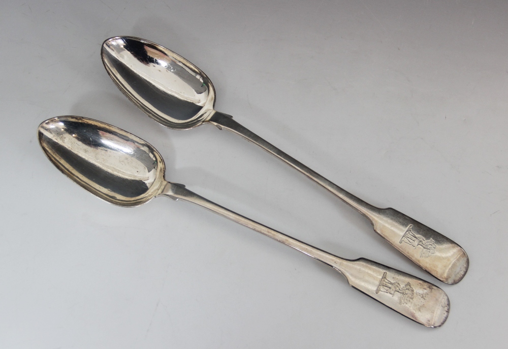 A pair of Victorian silver fiddle pattern serving spoons, Reid & Sons, Newcastle 1871, each