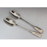 A pair of Victorian silver fiddle pattern serving spoons, Reid & Sons, Newcastle 1871, each