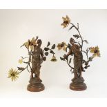A pair of French Art Nouveau spelter figural table lamps, titled 'Muse des Bois' and 'Chant des
