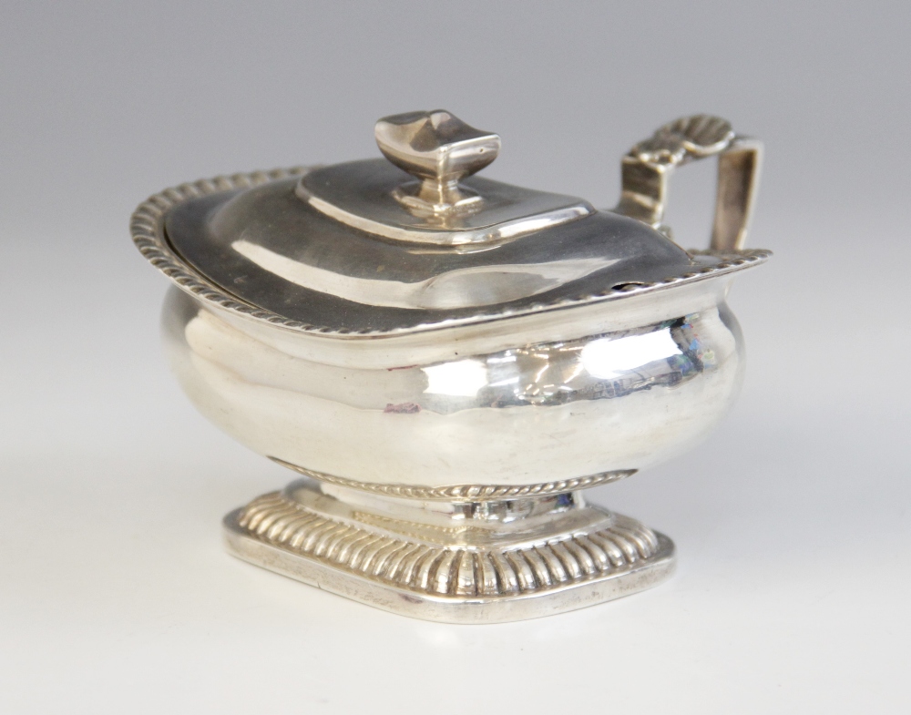 A George III silver wet mustard pot, London 1813 (maker's mark worn), of squat form on raised reeded