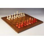 A late 19th century stained ivory Staunton style pattern chess set, within a Mackett Beeson box with