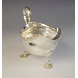 A George III silver sauce boat, marks for London 1761 (maker's marks worn), of typical form with