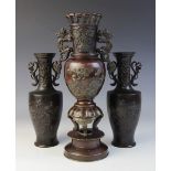 A Japanese bronze altar vase, Meiji period (1868-1912), applied with dragon lug handles and relief