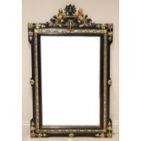 A Louis XVI style ebonised and gilt composite wall mirror, late 20th century, the rectangular