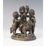 A bronze figural group, 19th century, modelled as a young Bacchus or Dionysis riding a lion