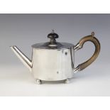 A George III silver bachelor?s teapot by William Troby, London 1812, of cylindrical form on four bun