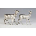 Two silver plated models of deer, each realistically modelled with fur effect chasing, one