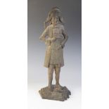 A cast iron fire companion stand, 20th century, modelled as a traditionally dressed town crier
