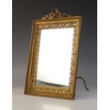 A French Belle Epoque brass mounted dressing table mirror, of rectangular easel form with pierced