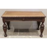 A Victorian carved oak gothic influence side table, the rectangular top with a lunette carved border