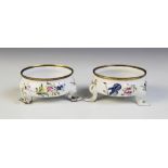 A pair of Bilston type enamel salts, early 19th century, of compressed circular form with cabriole