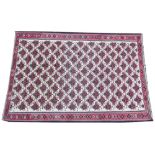 A Bashir type wool rug, woven red, cream blue and green dyes depicting multiple repeating gulls,
