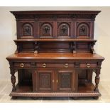 A Victorian carved oak Jacobean revival buffet/sideboard, the high back with a moulded cornice