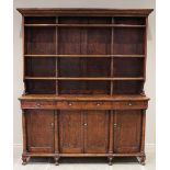 A mid 19th century elm dresser, possibly French, the high back with a moulded cornice over three