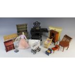 A selection of vintage dolls house furniture and accessories, to include; a cast iron range