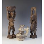 Two West African carved fertility figures, Dogon/Senufo Tribe, one modelled as a lady carrying a