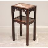 A Chinese hardwood and marble nightstand, early 20th century, the rectangular top inset with a rouge