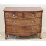 An early 19th century mahogany bow front chest of drawers, formed as two short over two long drawers