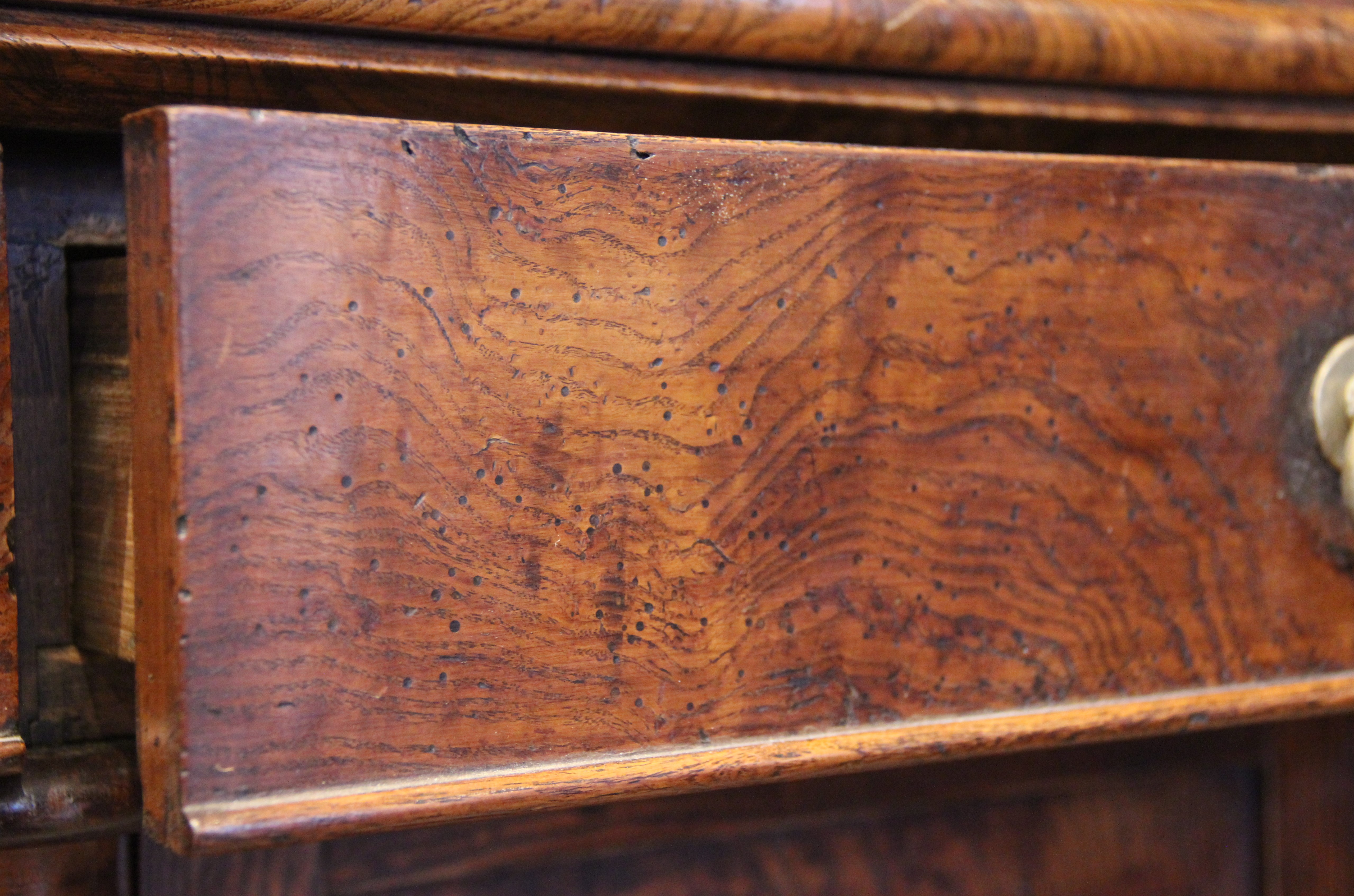 A mid 19th century elm dresser, possibly French, the high back with a moulded cornice over three - Image 5 of 15