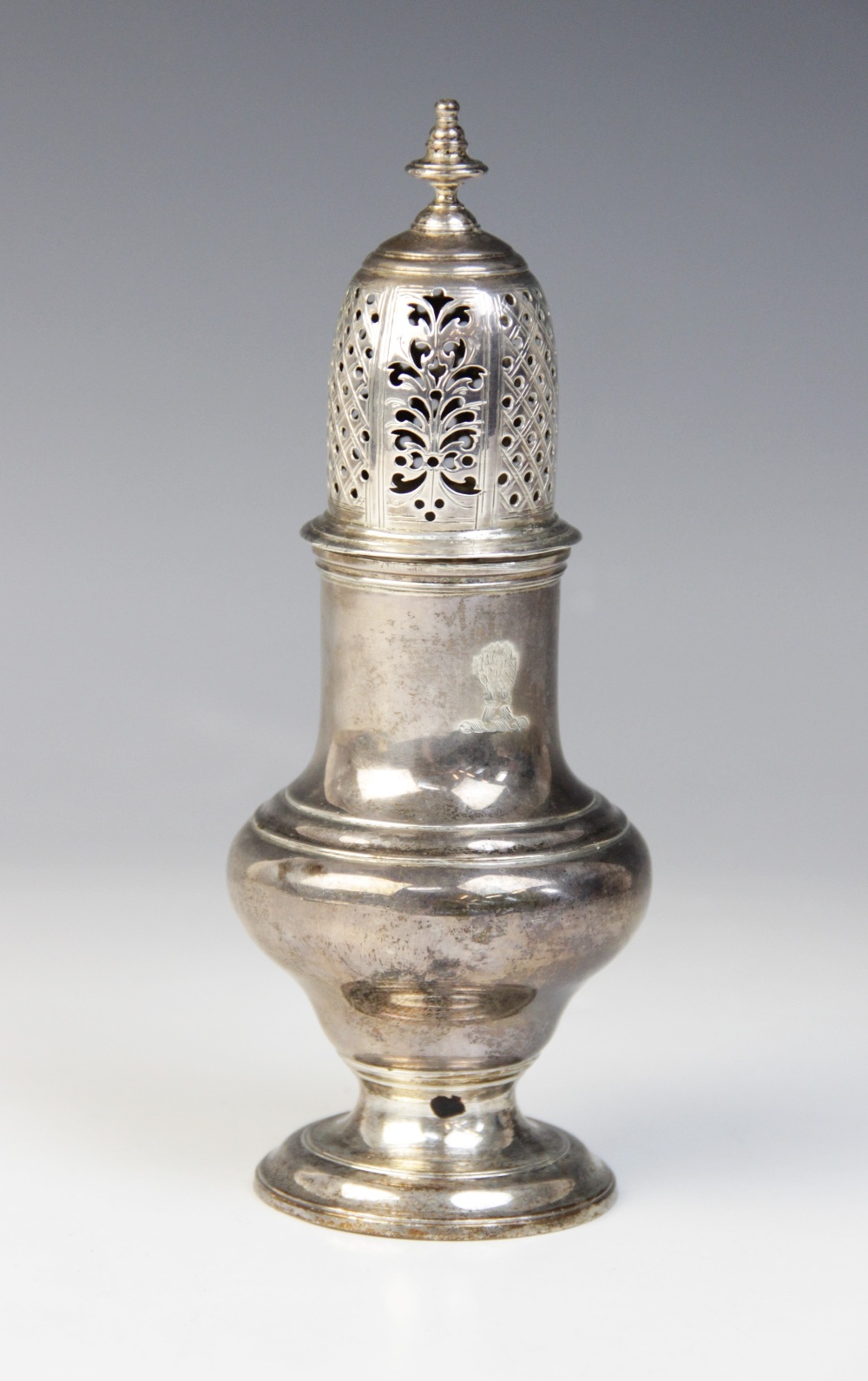 A George II silver sugar caster, Samuel Wood, London 1741, of baluster form on circular foot with